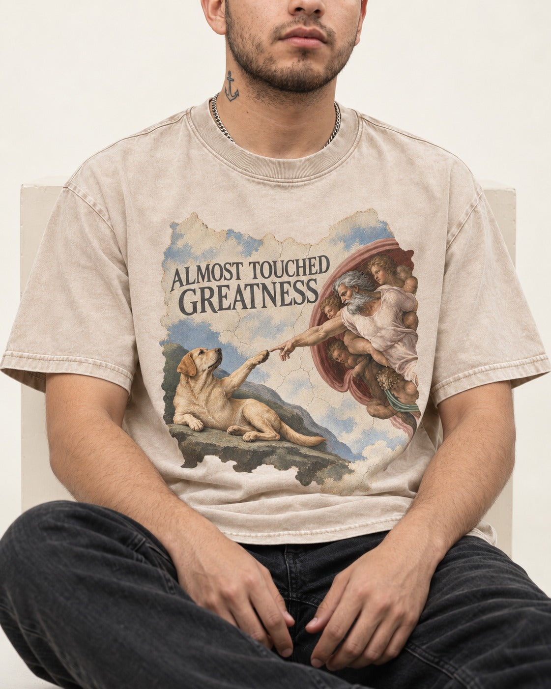 Labrador Retriever Almost Touched Greatness Washed Tee in Apricot, worn by a seated model