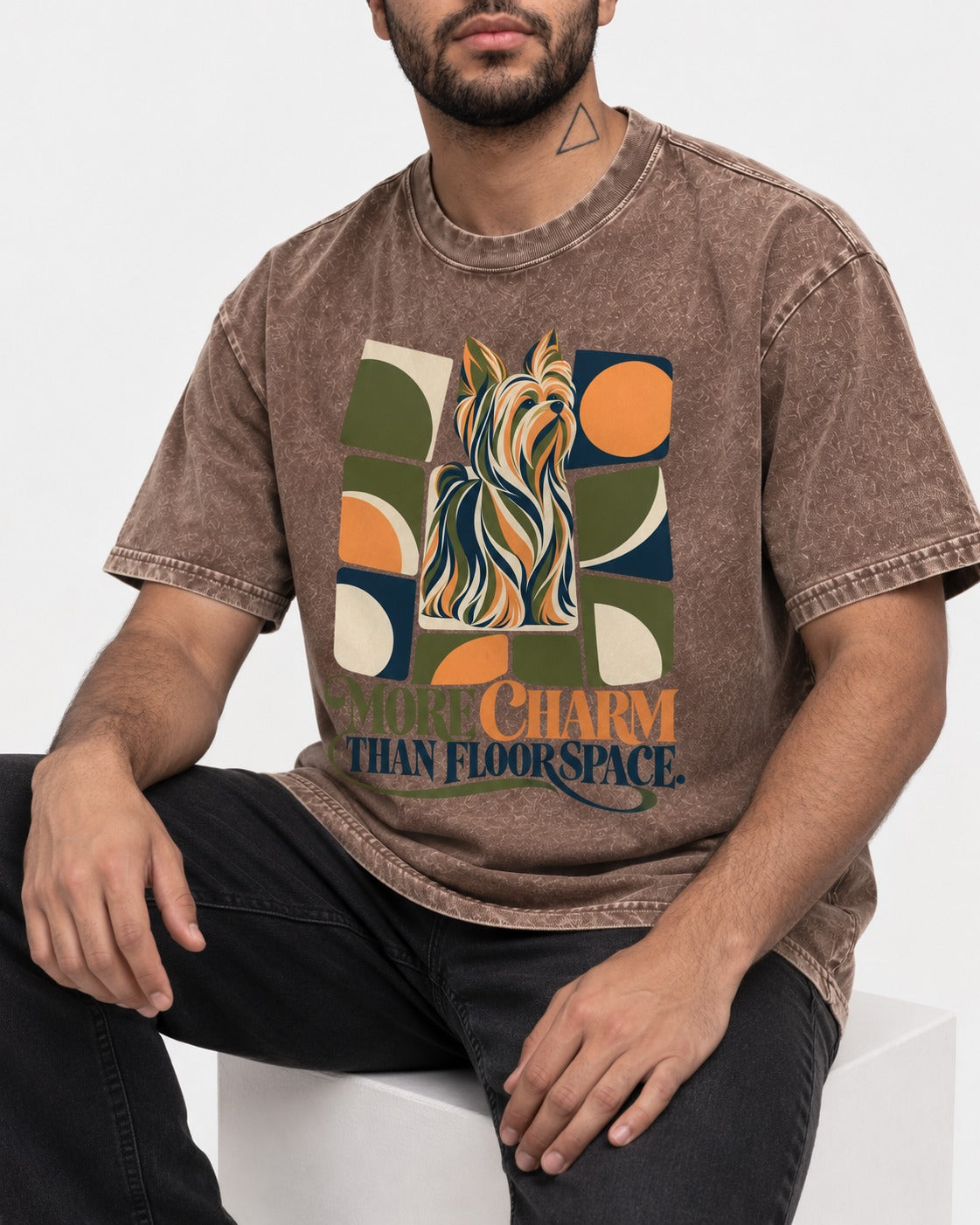 Yorkshire Terrier More Charm Than Space Washed Tee in Coffee, worn by a seated model