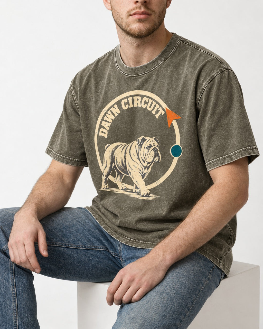 English Bulldog Dawn Circuit Emblem Washed Tee in Army Green, worn by a seated model