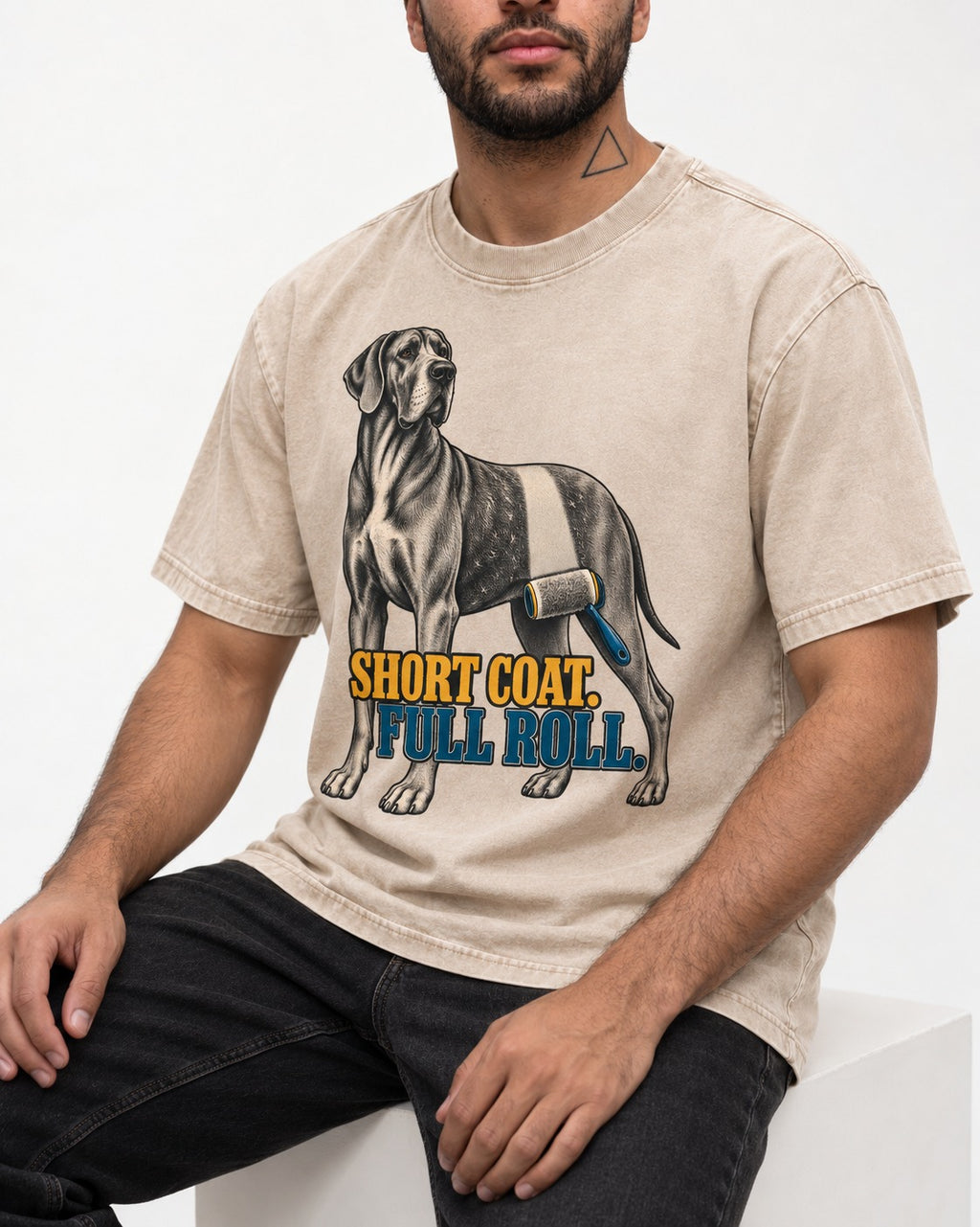 Short Coat Full Roll Great Dane Washed Tee in Apricot, worn by a seated model