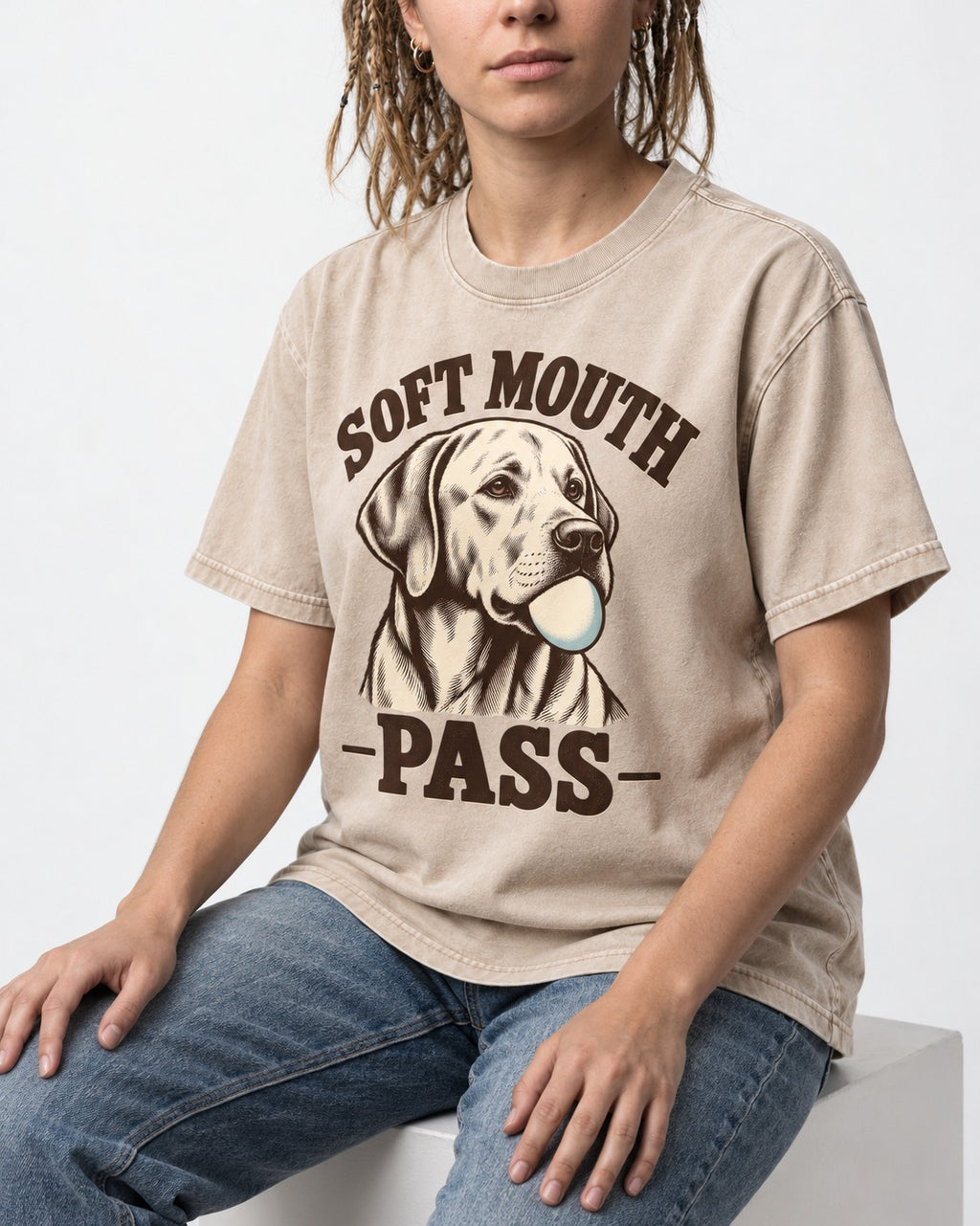 Soft Mouth Pass Labrador Retriever Washed Tee in Apricot, worn by a seated model