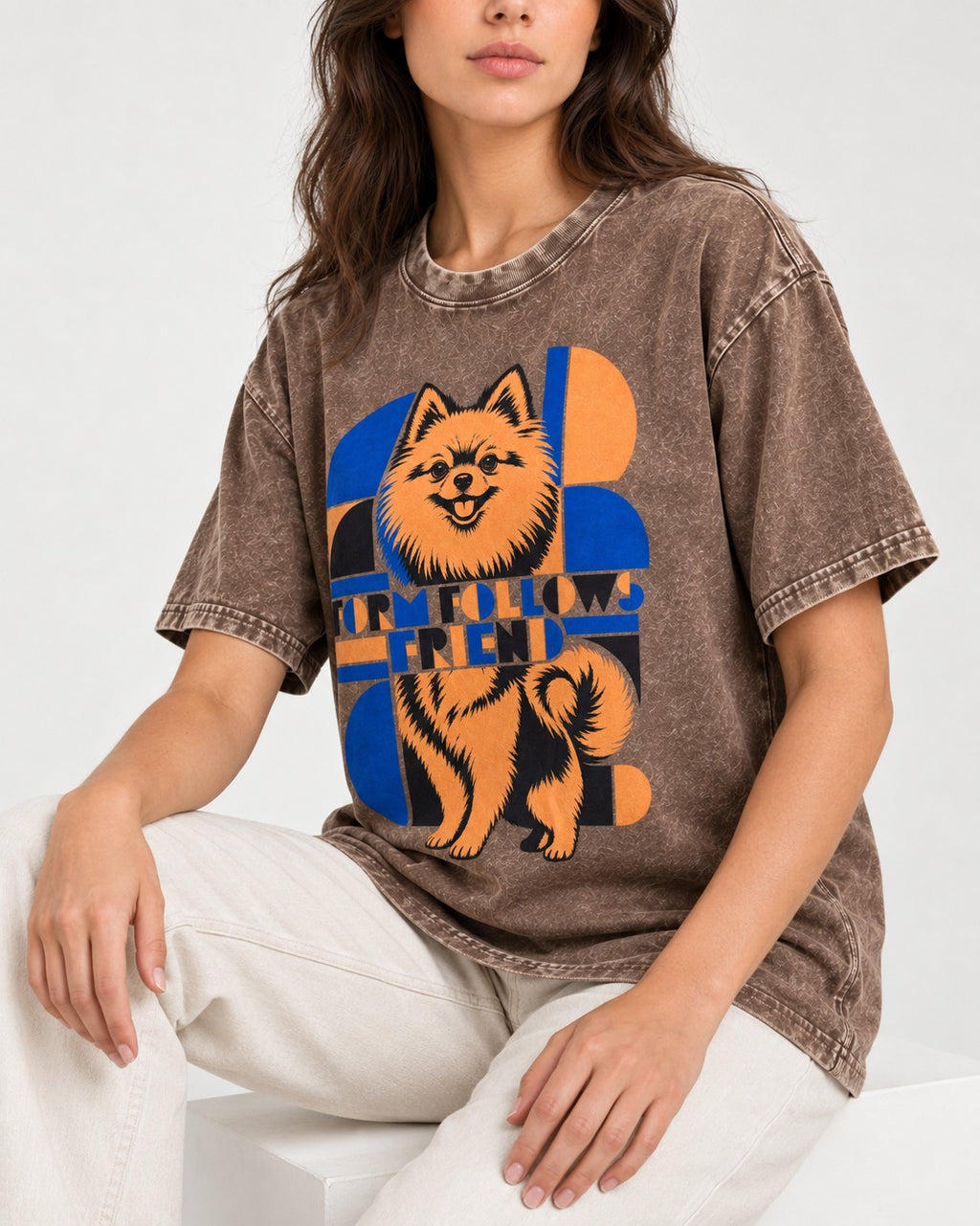 Form Follows Pomeranian Friend Washed Tee in Coffee, worn by a seated model