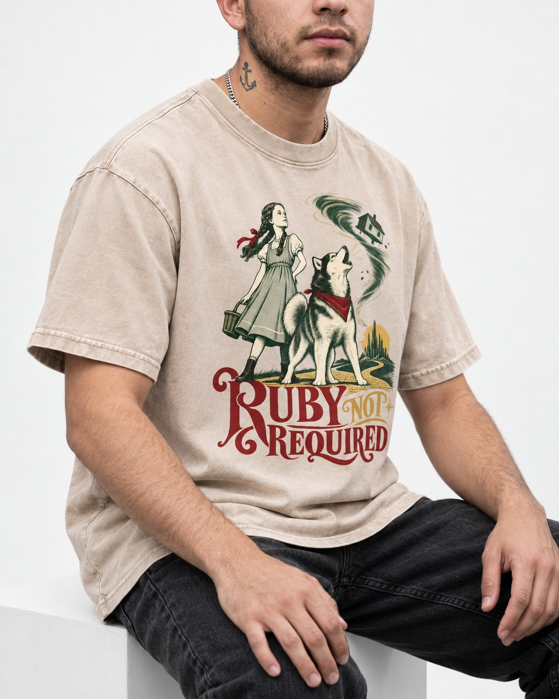 Ruby Not Required for Husky Washed Tee in Apricot, worn by a seated model