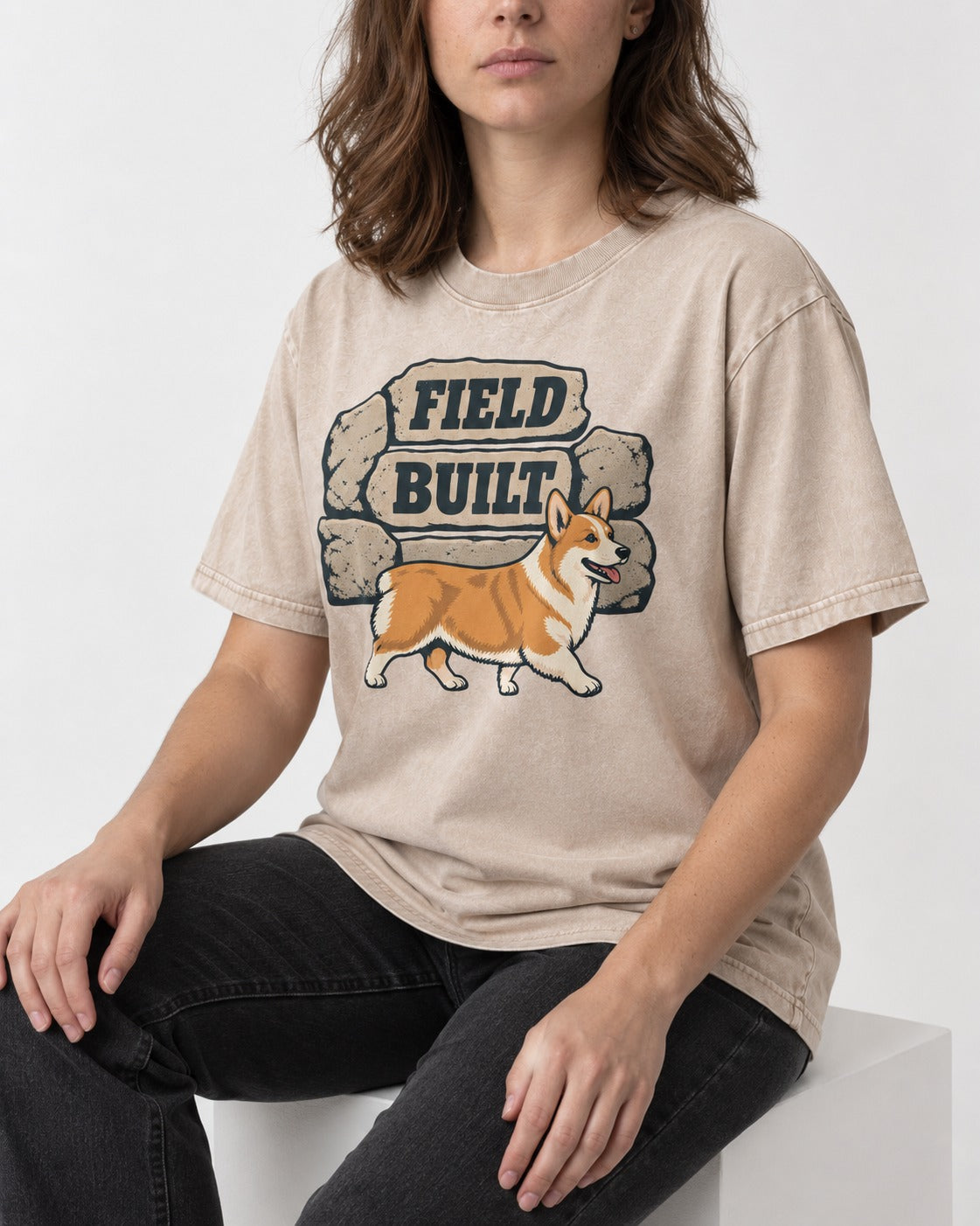 Field Built Corgi Washed Tee in Apricot, worn by a seated model