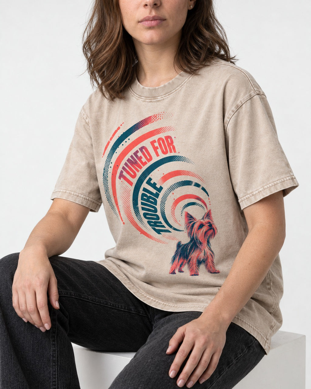 Yorkshire Terrier Tuned for Trouble Washed Tee in Apricot, worn by a seated model