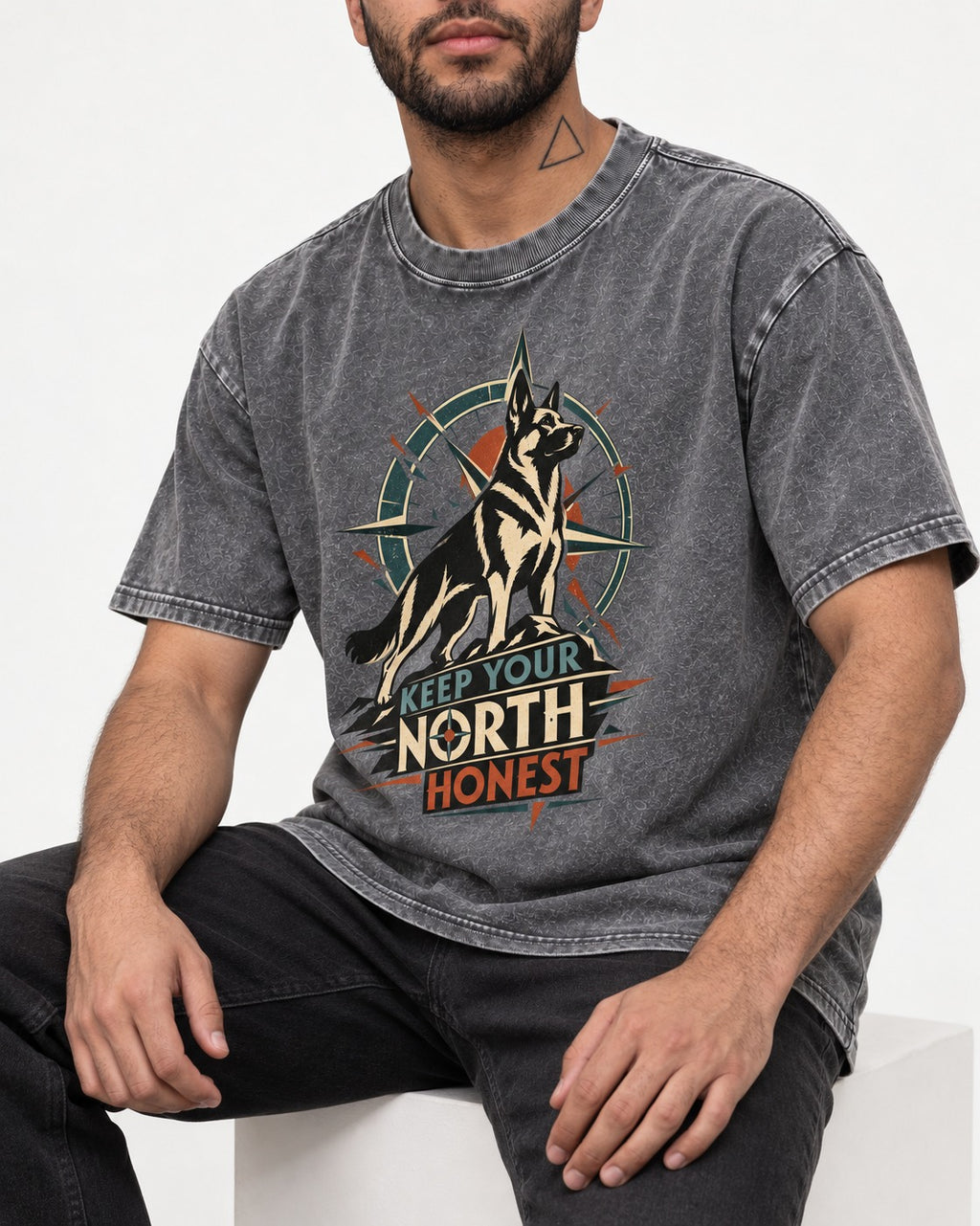 Keep Your North Honest Compass German Shepherd Dog Graphic Washed Tee in Gray, worn by a seated model