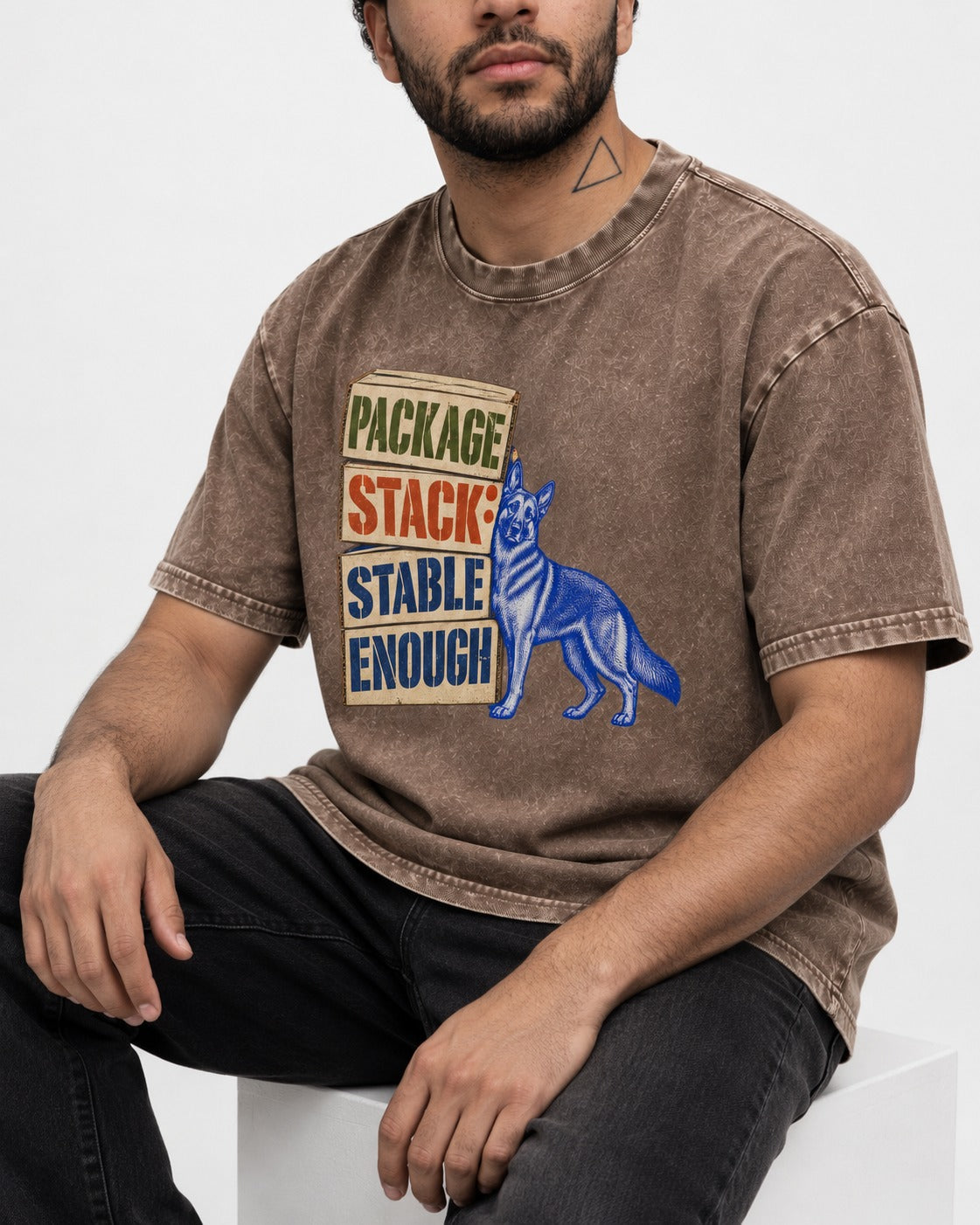 Package Stack Stable Enough German Shepherd Dog Washed Tee in Coffee, worn by a seated model