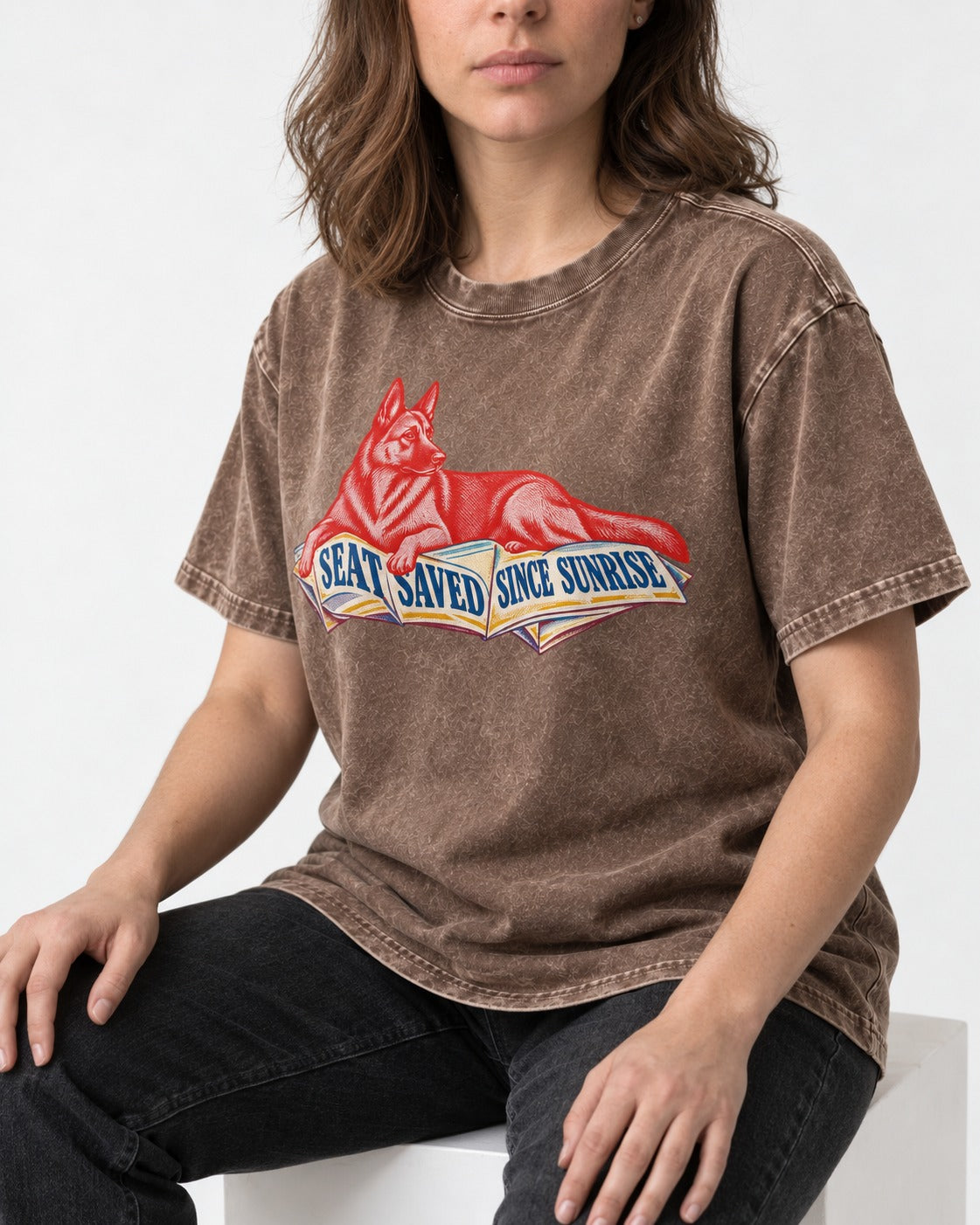 Seat Saved Since Sunrise German Shepherd Dog Washed Tee in Coffee, worn by a seated model