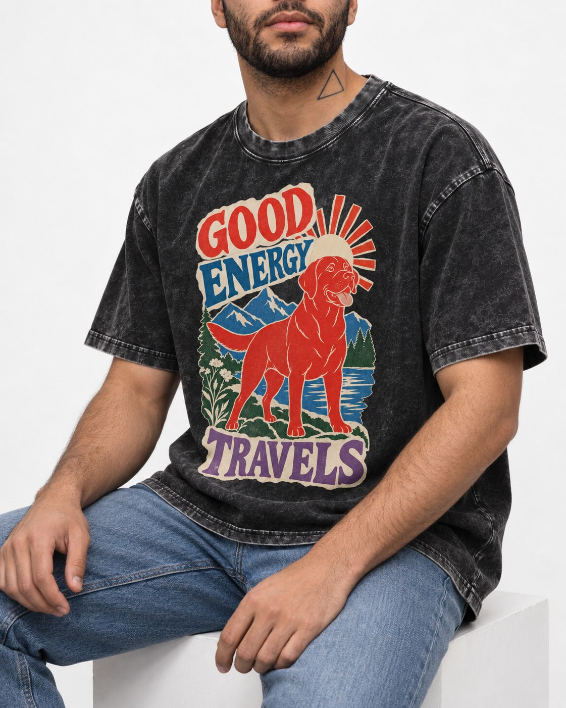 Labrador Retriever Good Energy Travels Adventure Graphic Washed Tee in Black, worn by a seated model