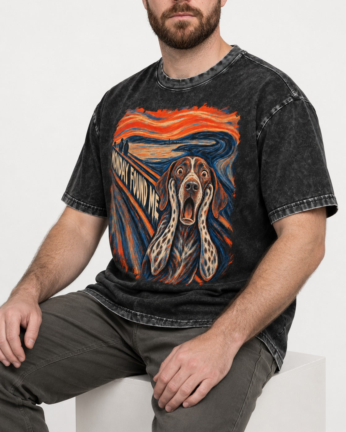 German Shorthaired Pointer Monday Found Me Scream Parody Graphic Washed Tee in Black, worn by a seated model