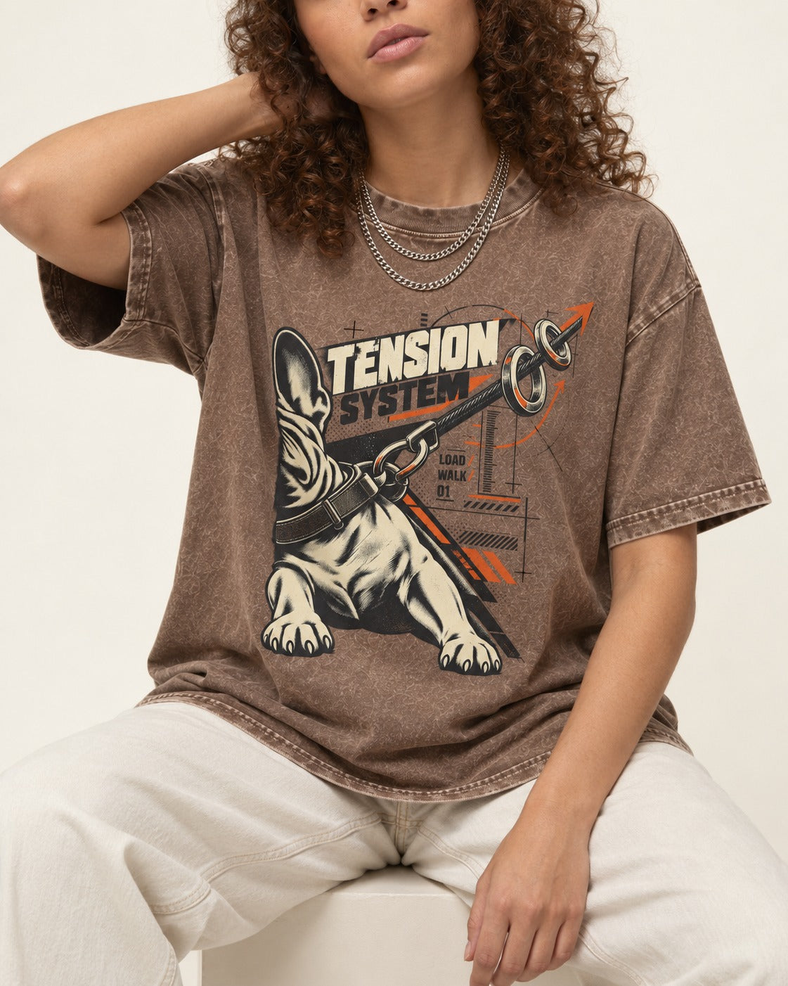 Frenchie Tension System Washed Tee in Coffee, worn by a seated model