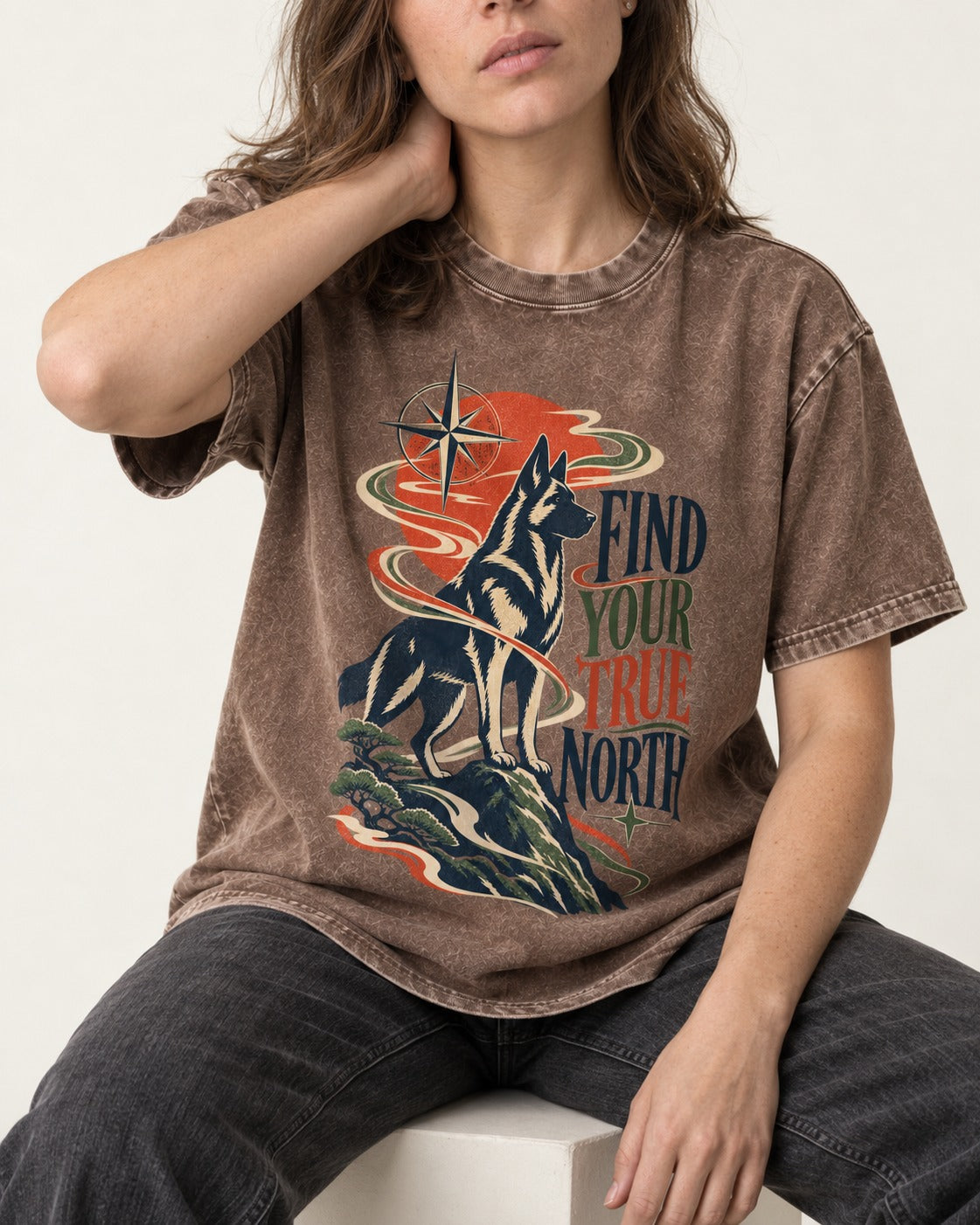 Find Your True North German Shepherd Dog Washed Tee in Coffee, worn by a seated model