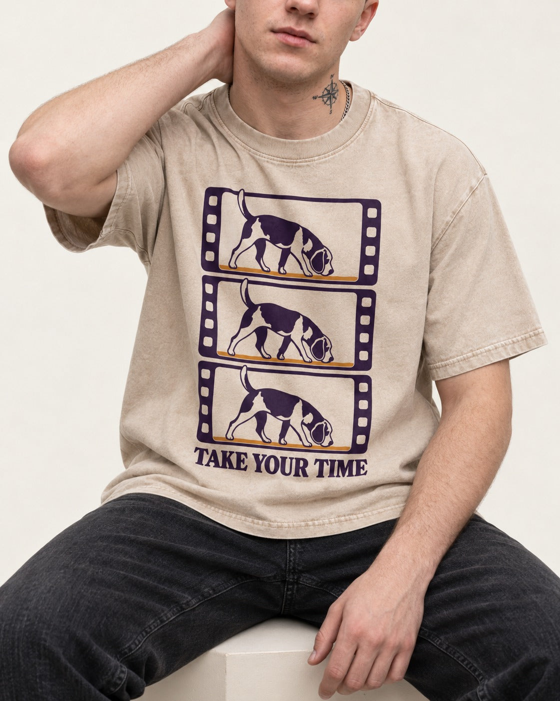 Beagle Take Your Time Washed Tee in Apricot, worn by a seated model