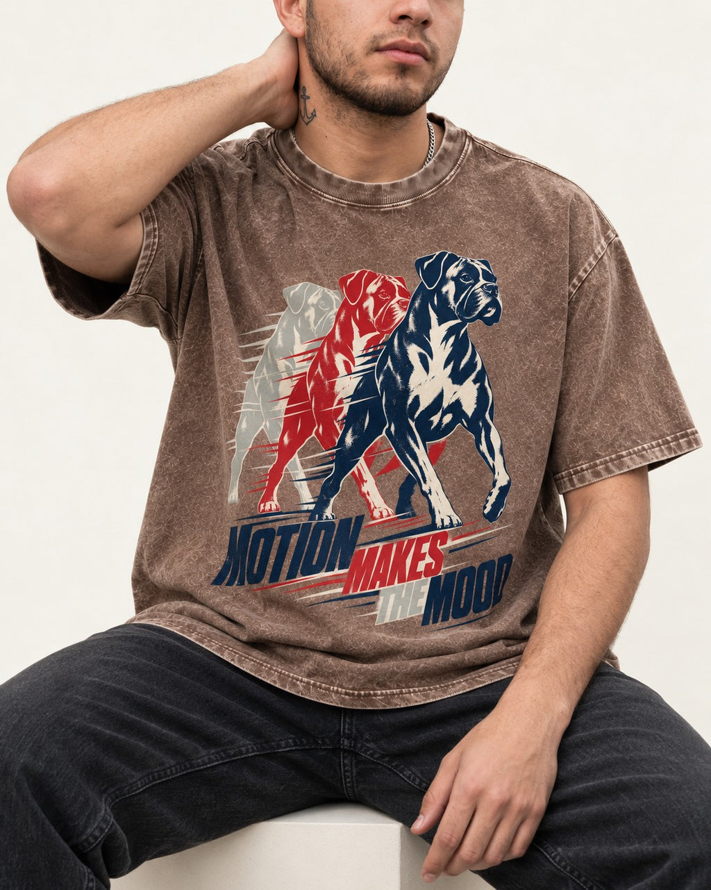 Boxer Motion Makes the Mood Washed Tee in Coffee, worn by a seated model