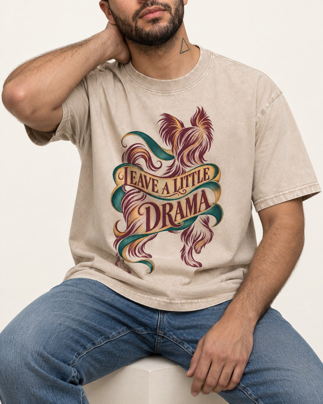 Leave a Little Drama Yorkshire Terrier Washed Tee in Apricot, worn by a seated model