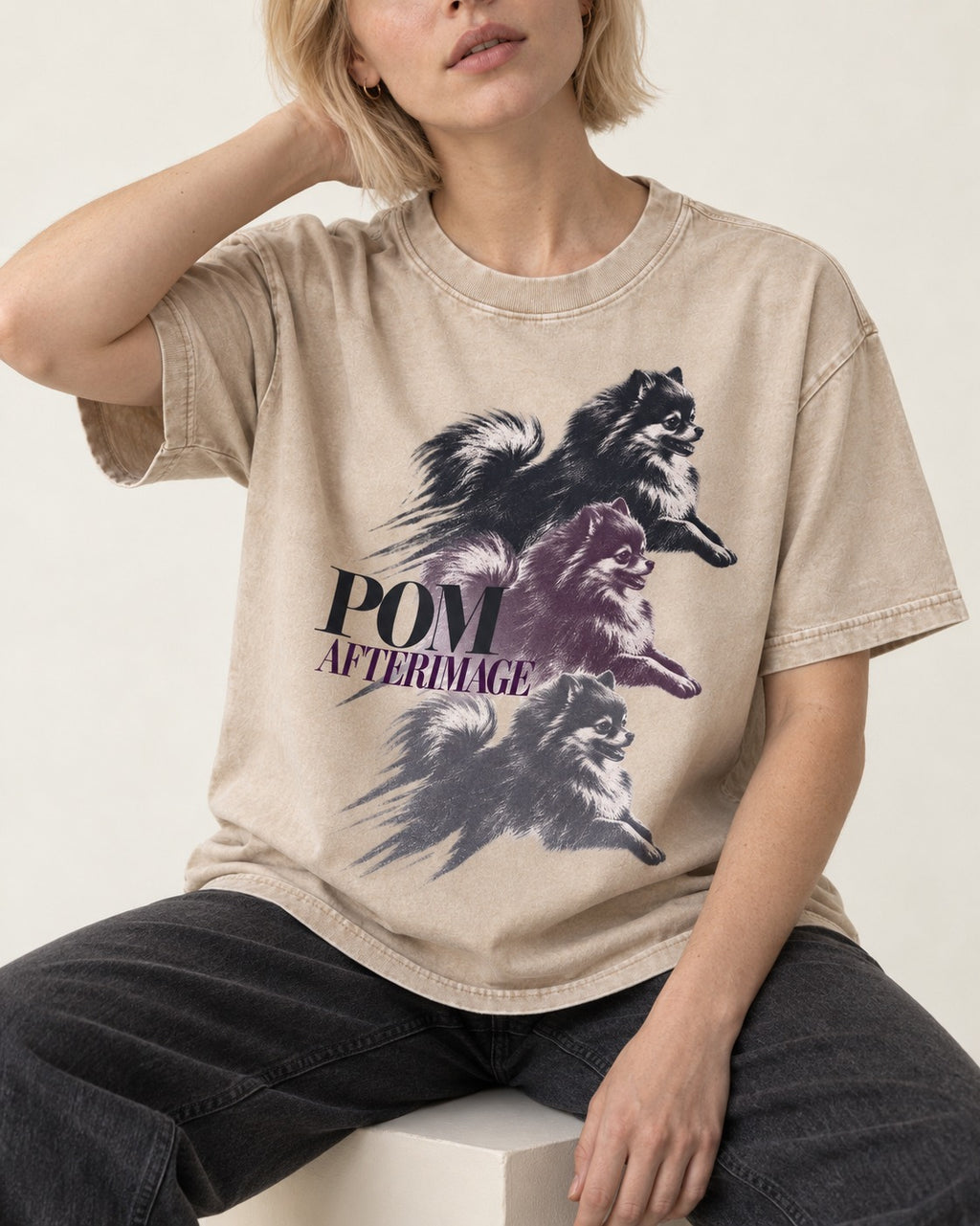 Pomeranian Afterimage Washed Tee in Apricot, worn by a seated model