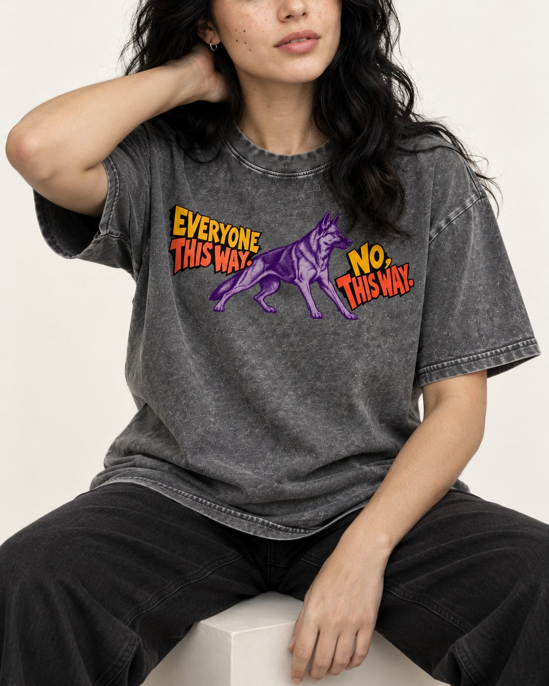 German Shepherd Dog Everyone This Way No This Way Direction Graphic Washed Tee in Gray, worn by a seated model
