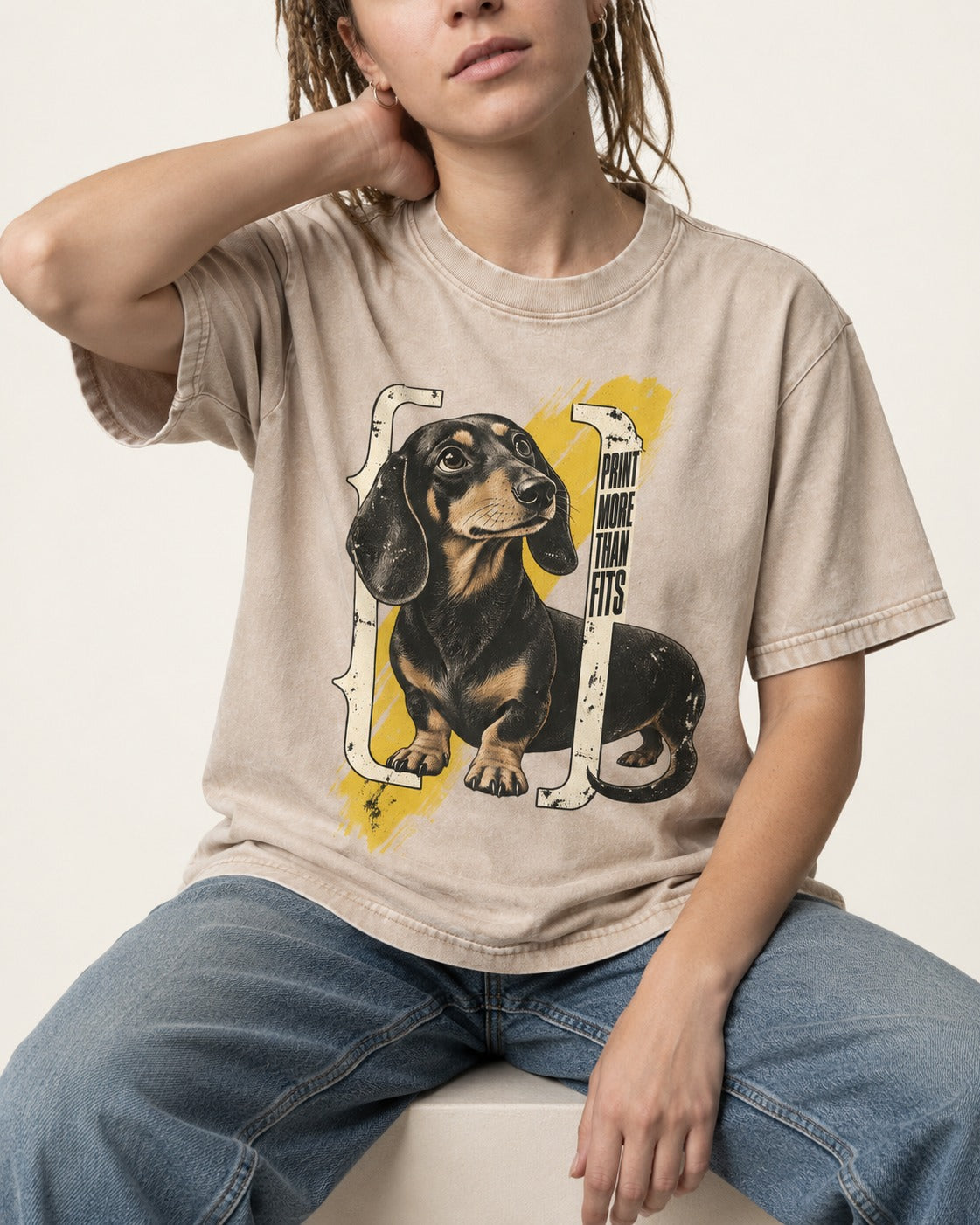 Dachshund More Than Fits Washed Tee in Apricot, worn by a seated model