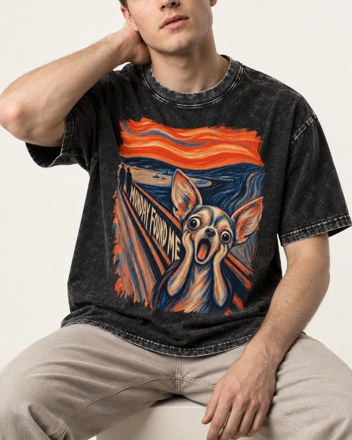 Monday Found Me Chihuahua Scream Path Washed Tee in Black, worn by a seated model