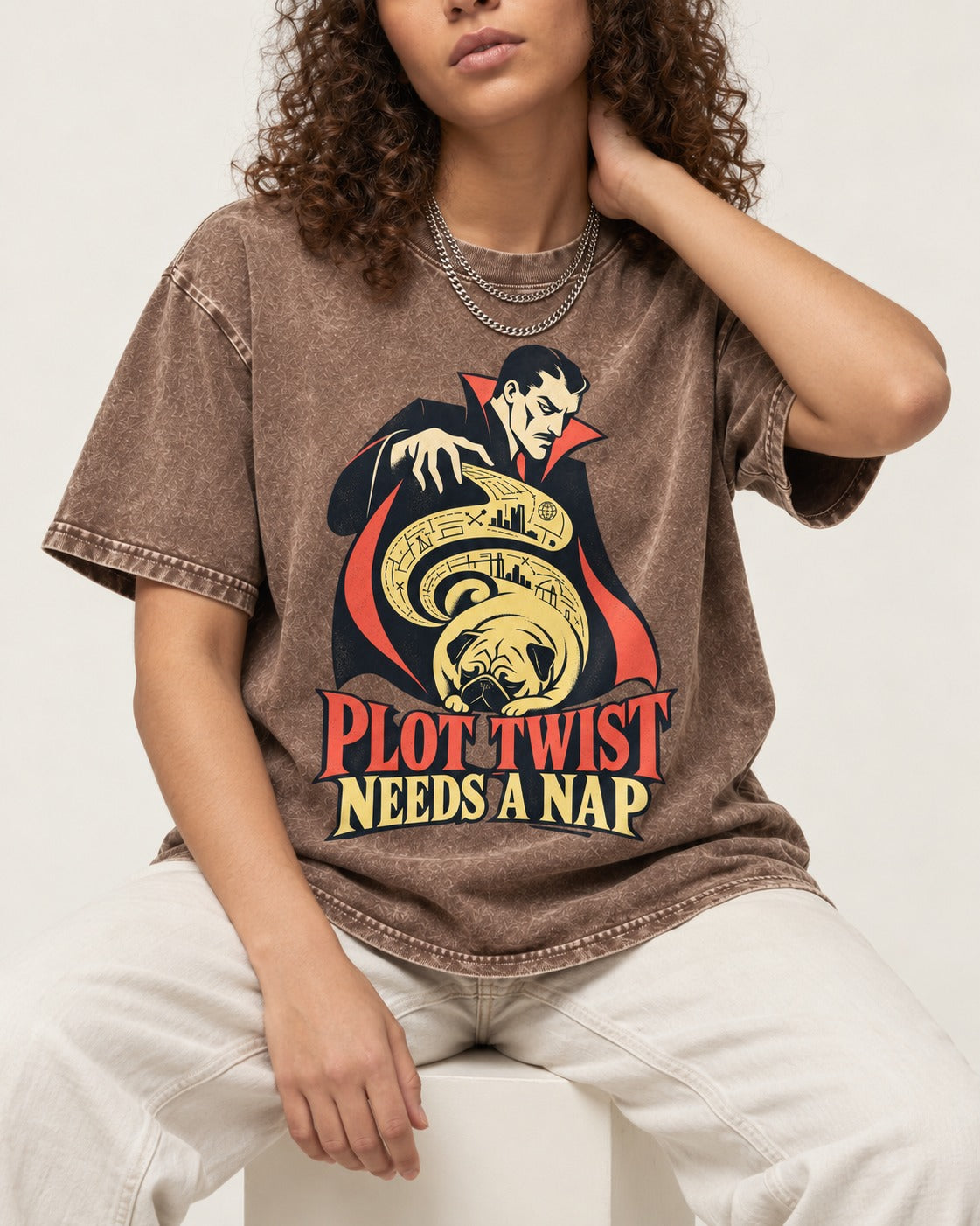 Pug Needs a Nap Washed Tee in Coffee, worn by a seated model