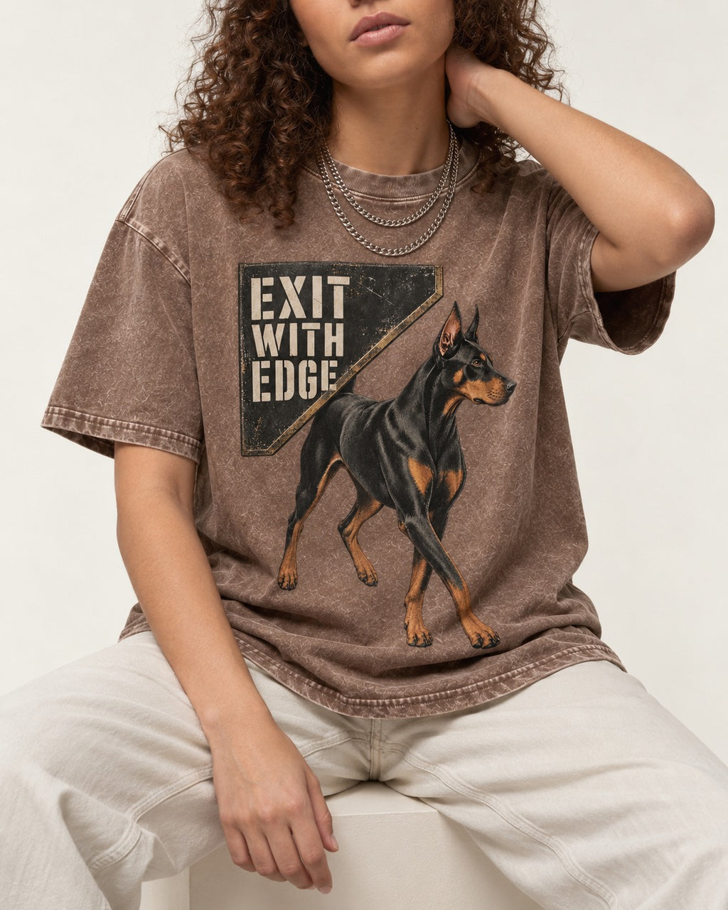 Exit with Doberman Edge Washed Tee in Coffee, worn by a seated model