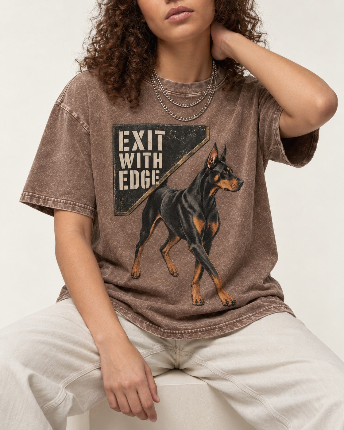 Exit with Doberman Edge Washed Tee in Coffee, worn by a seated model