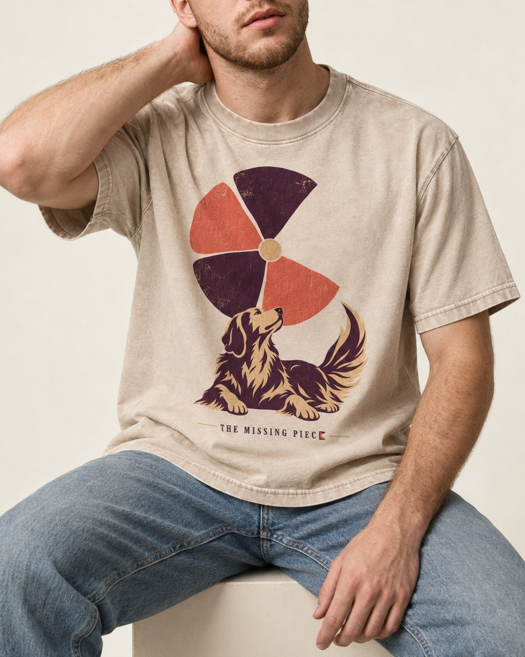 Golden Retriever Is My Missing Piece Washed Tee in Apricot, worn by a seated model