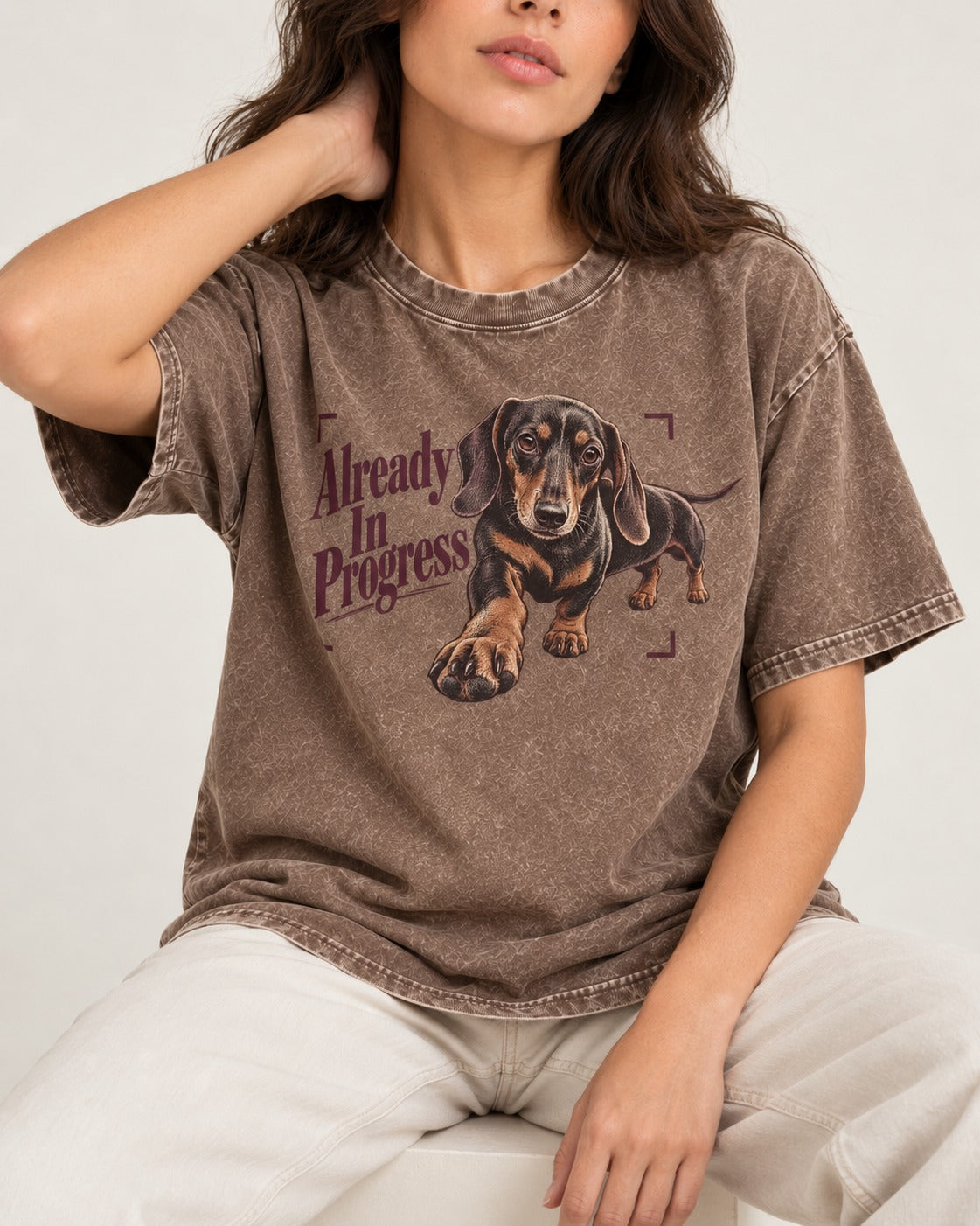 Dachshund Already in Progress Washed Tee in Coffee, worn by a seated model