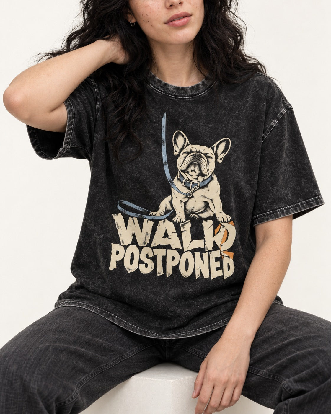 Frenchie Walk Postponed Leash Graphic Washed Tee in Black, worn by a seated model