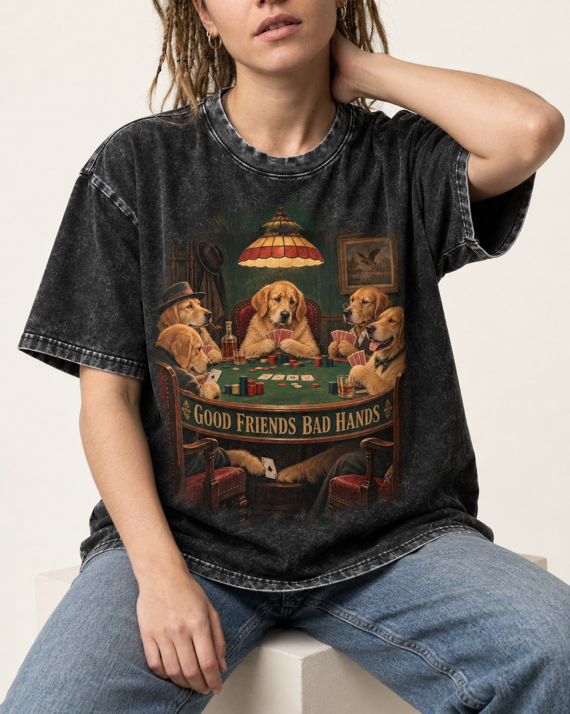 Good Friends Bad Hands Poker Golden Retriever Graphic Washed Tee in Black, worn by a seated model