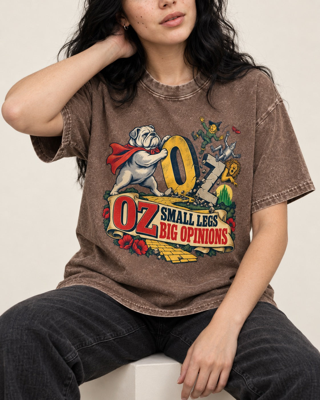 English Bulldog Small Legs Big Opinions Washed Tee in Coffee, worn by a seated model