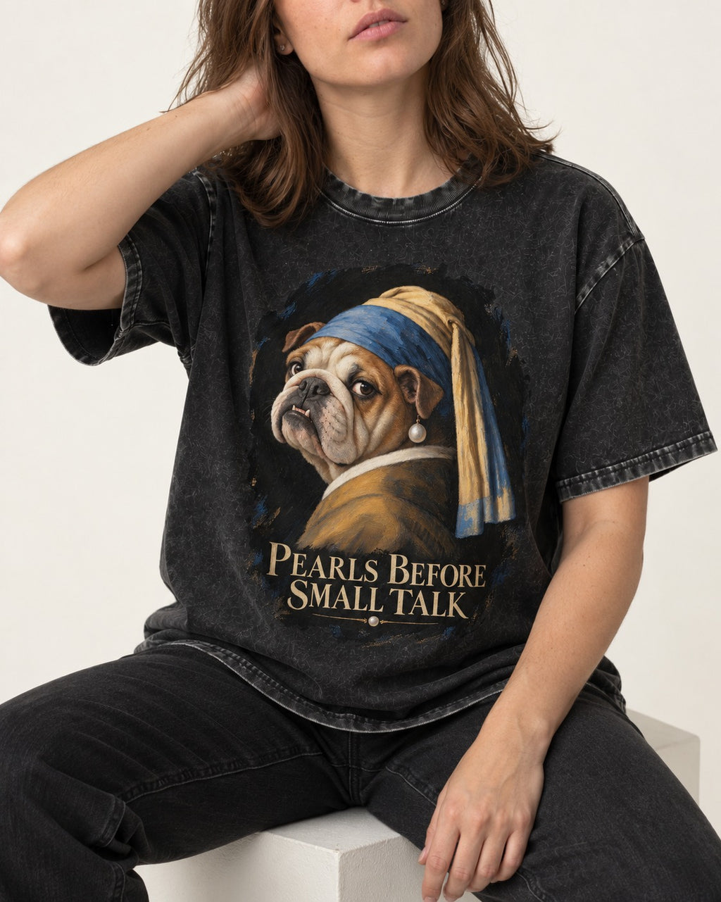 English Bulldog Pearls Before Small Talk Portrait Washed Tee in Black, worn by a seated model