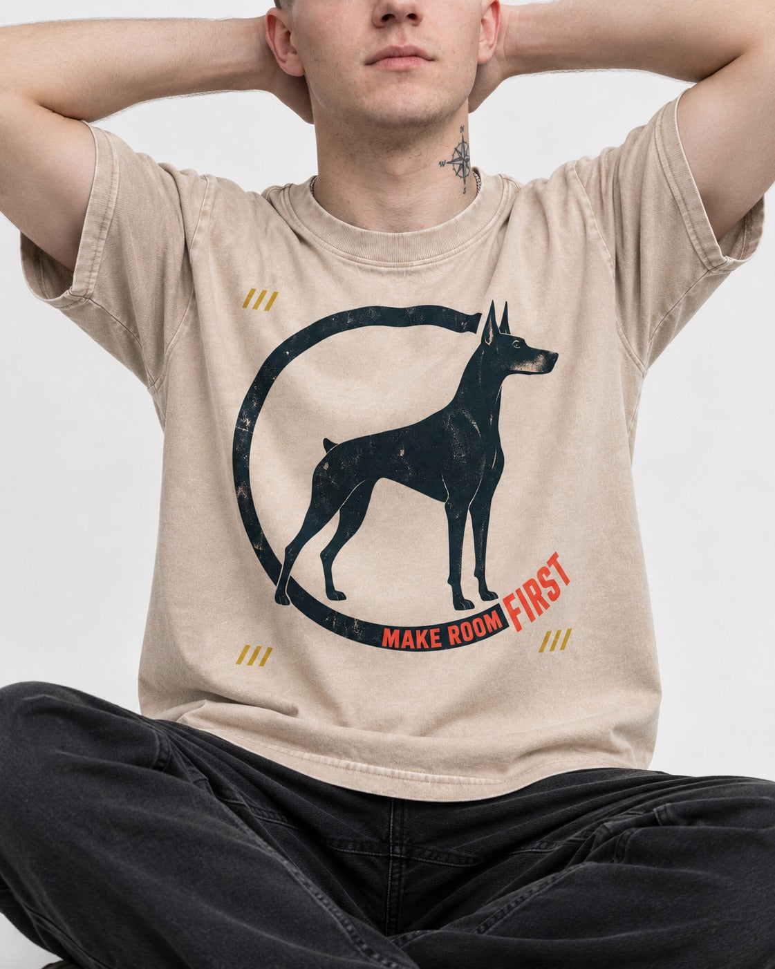 Make Room First Doberman Washed Tee in Apricot, worn by a seated model