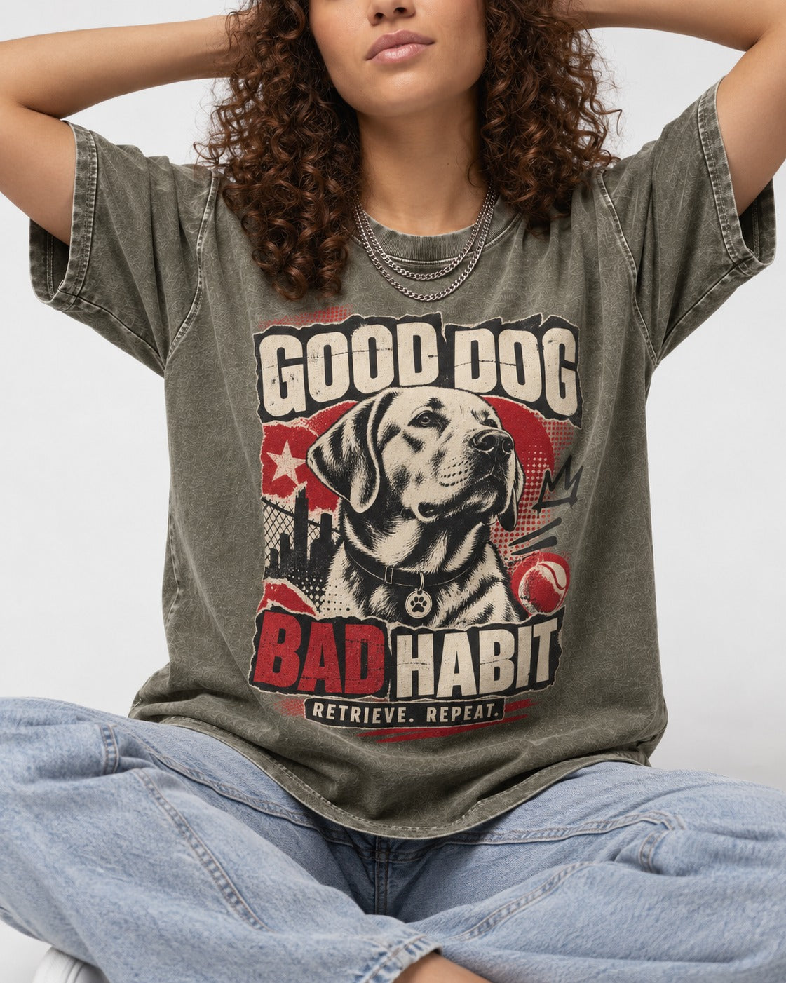 Labrador Retriever Good Dog Bad Habit Poster Graphic Washed Tee in Army Green, worn by a seated model