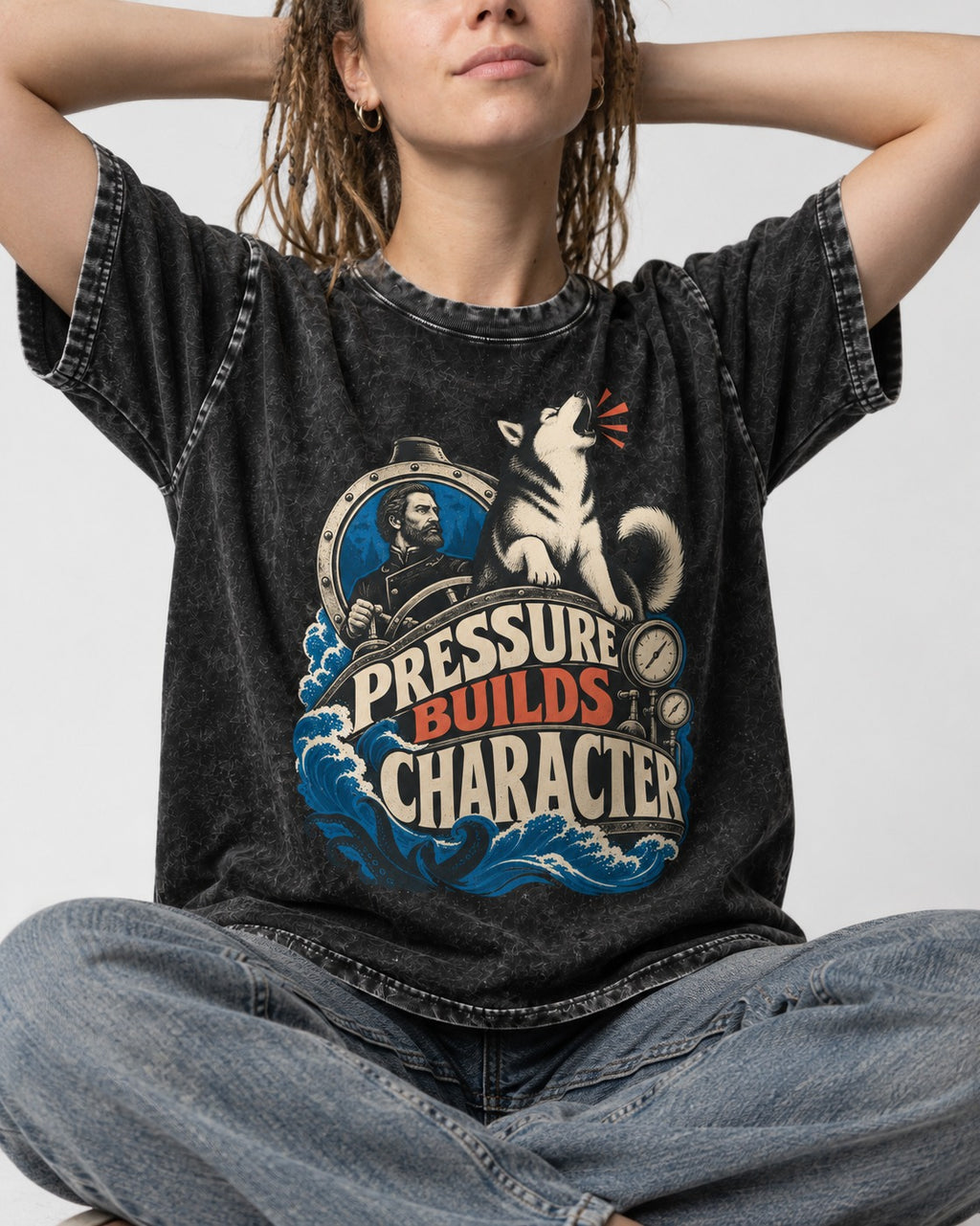 Husky Pressure Builds Character Deep Sea Graphic Washed Tee in Black, worn by a seated model