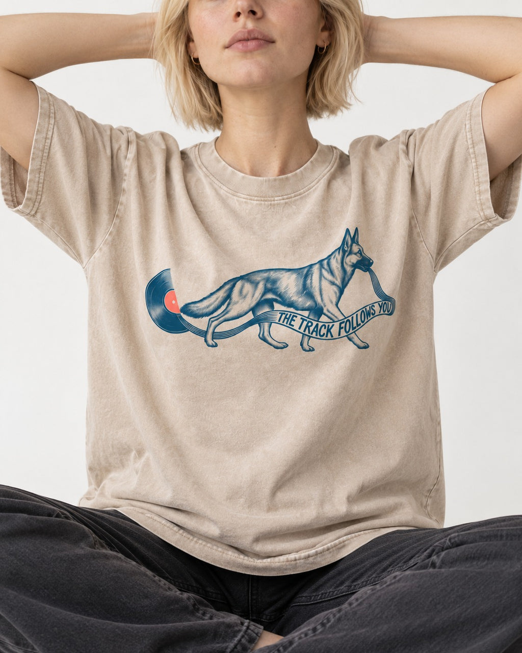 German Shepherd Dog The Track Follows You Washed Tee in Apricot, worn by a seated model