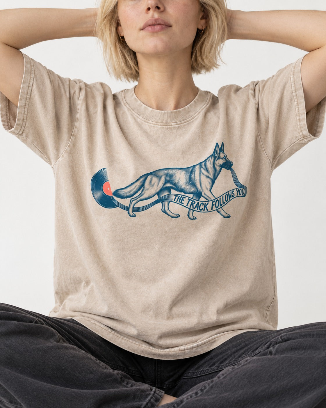 German Shepherd Dog The Track Follows You Washed Tee in Apricot, worn by a seated model