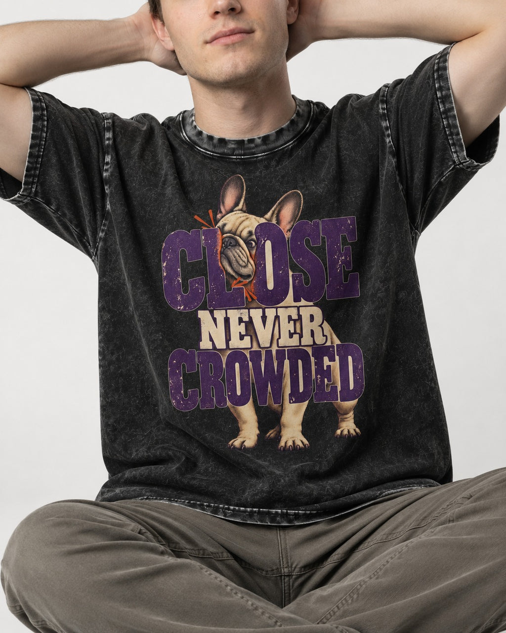 Frenchie Close Never Crowded Peekaboo Type Graphic Washed Tee in Black, worn by a seated model