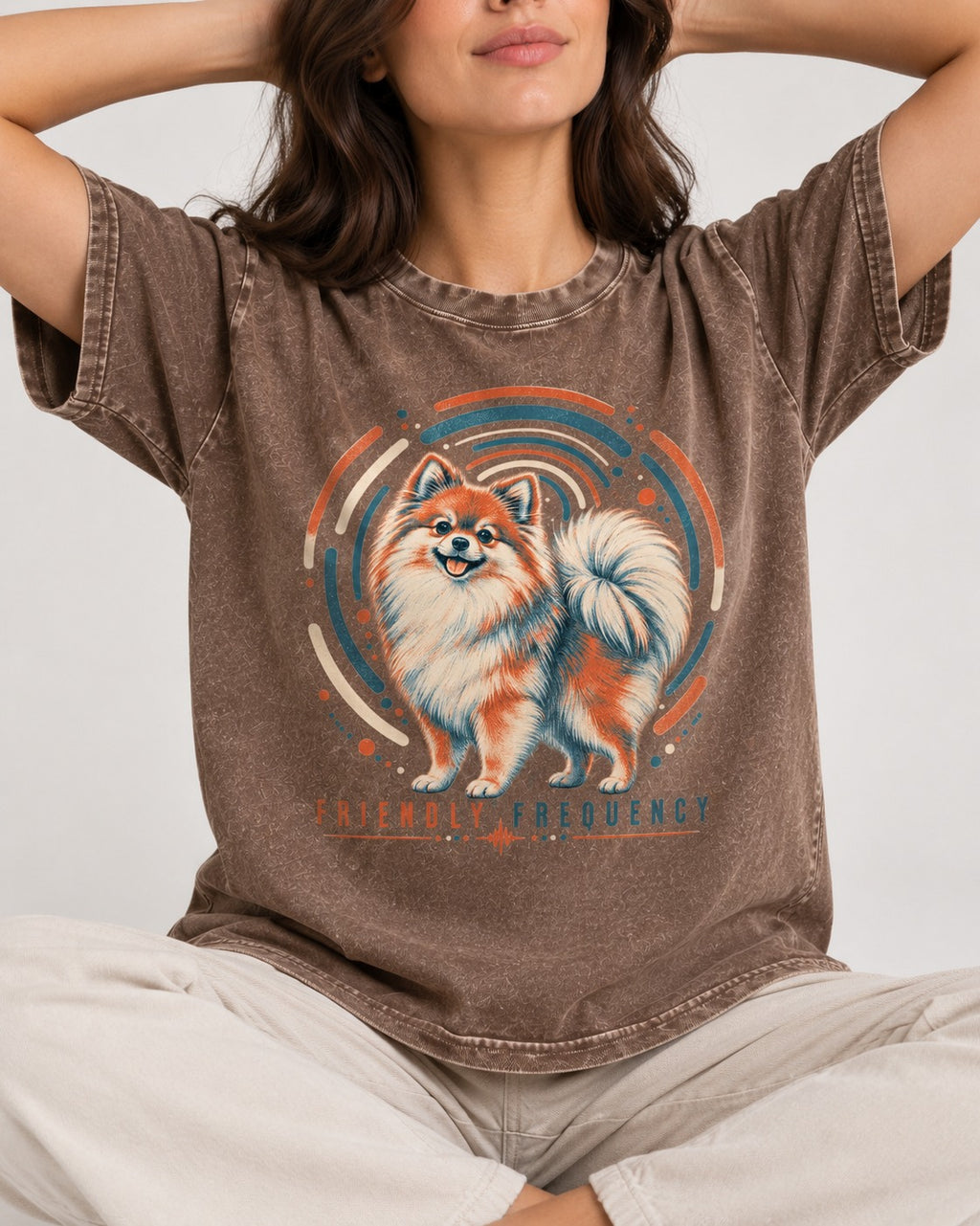 Friendly Frequency Pomeranian Washed Tee in Coffee, worn by a seated model