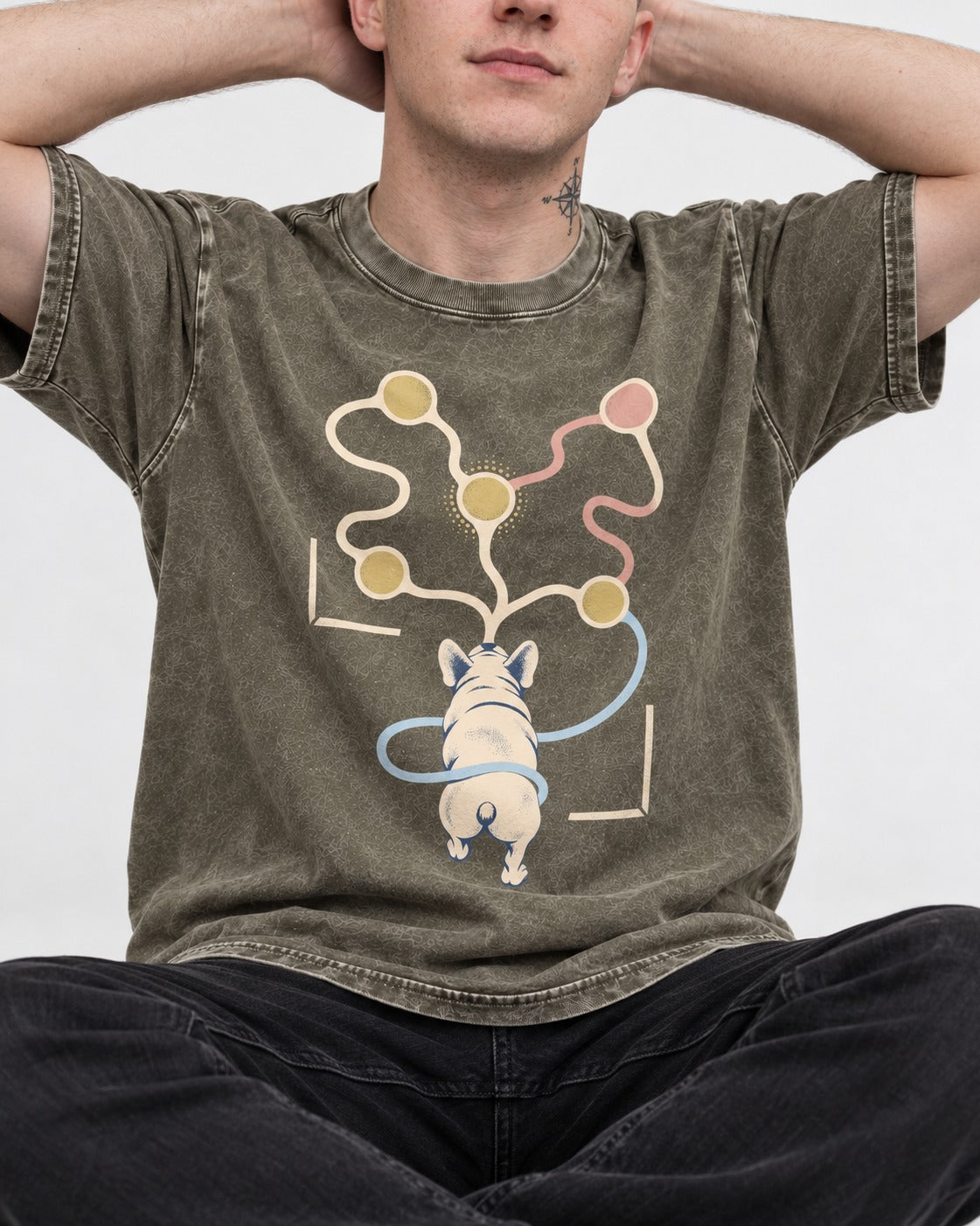 Frenchie Scent Circuit Rear View Graphic Washed Tee in Army Green, worn by a seated model