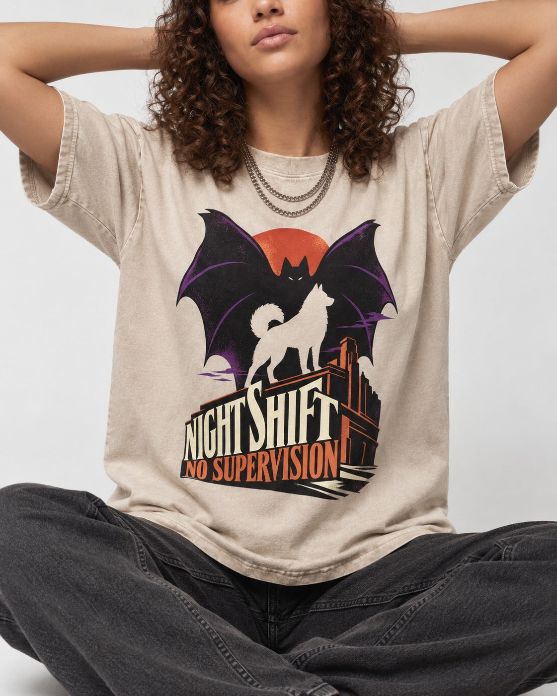 Husky Night Shift No Supervision Washed Tee in Apricot, worn by a seated model