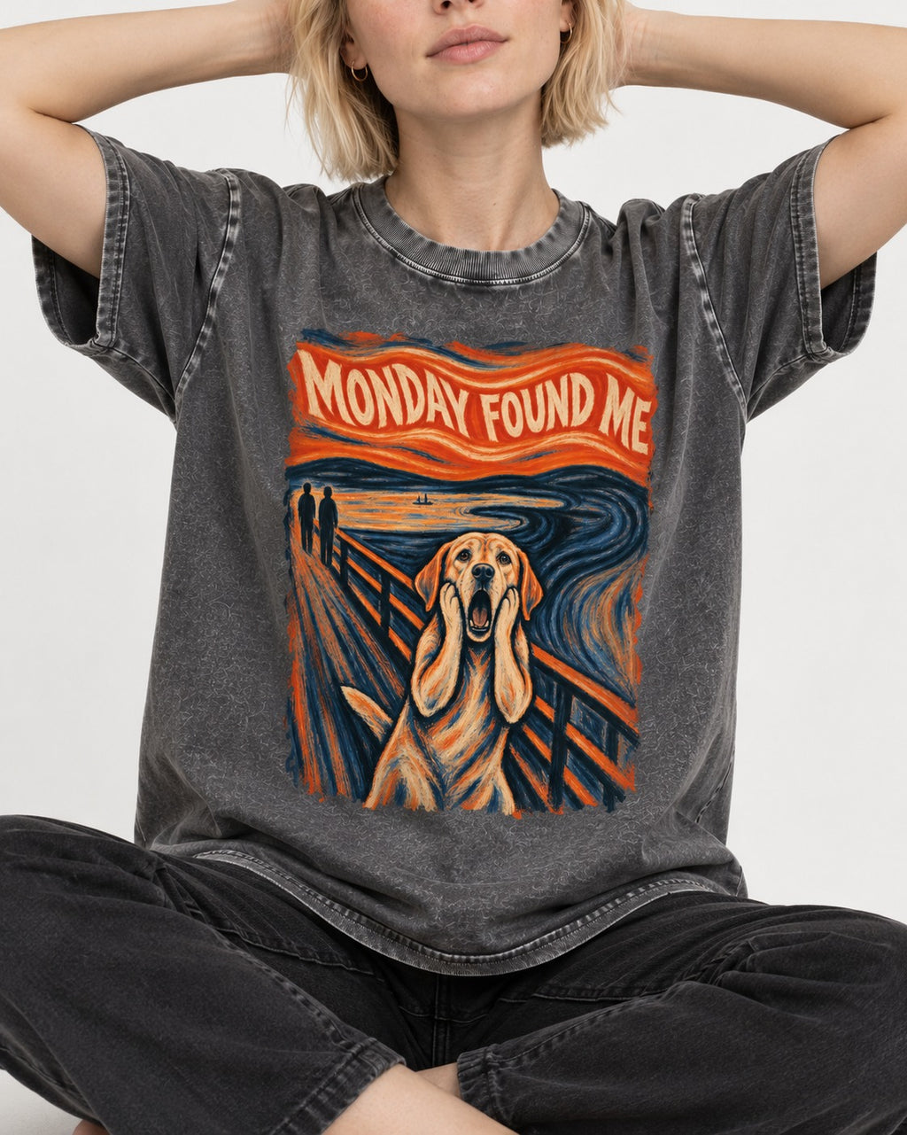 Labrador Retriever Monday Found Me Scream Parody Graphic Washed Tee in Gray, worn by a seated model