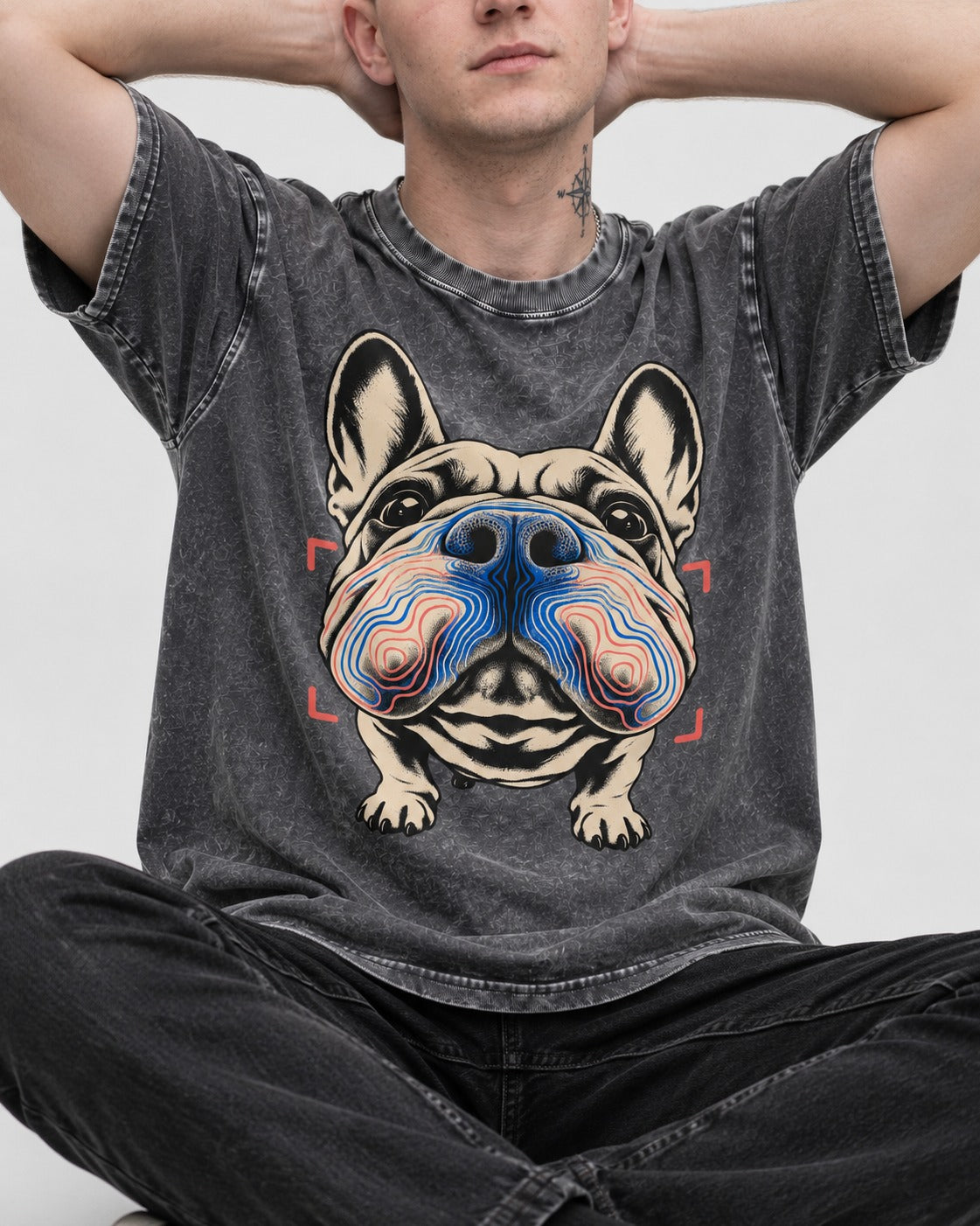 Frenchie Nose Topography Graphic Washed Tee in Gray, worn by a seated model