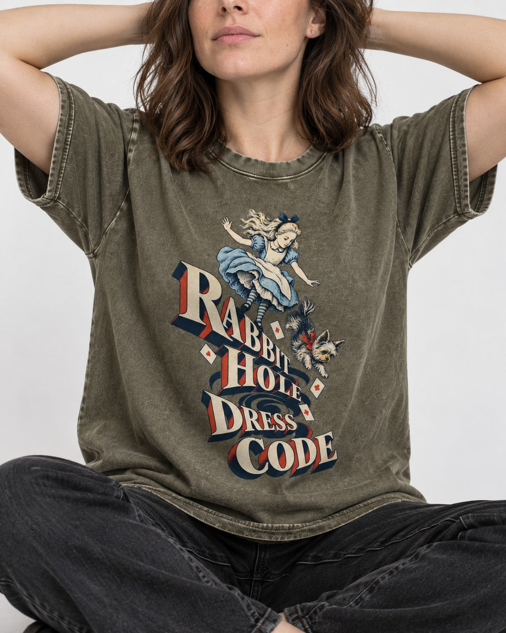 Yorkshire Terrier Rabbit Hole Dress Code Wonderland Graphic Washed Tee in Army Green, worn by a seated model