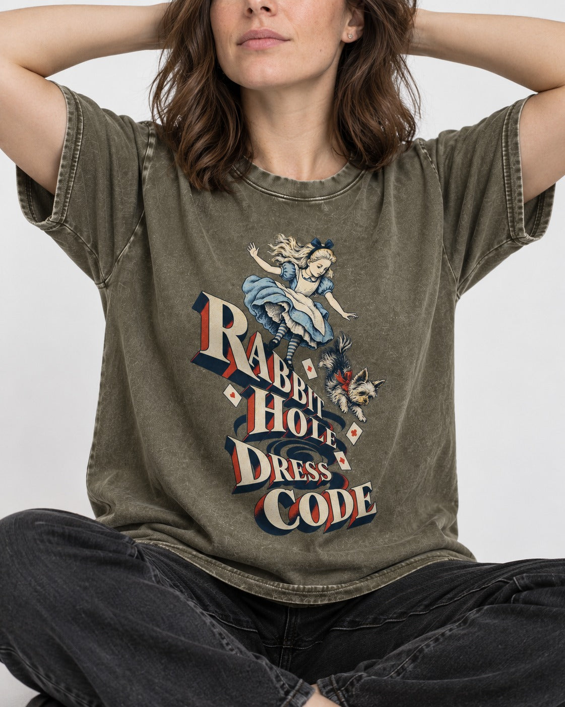 Yorkshire Terrier Rabbit Hole Dress Code Wonderland Graphic Washed Tee in Army Green, worn by a seated model