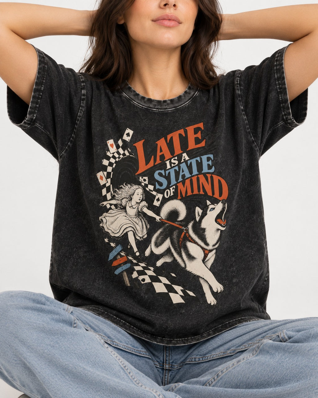 Husky Late Is a State of Mind Wonderland Chase Graphic Washed Tee in Black, worn by a seated model