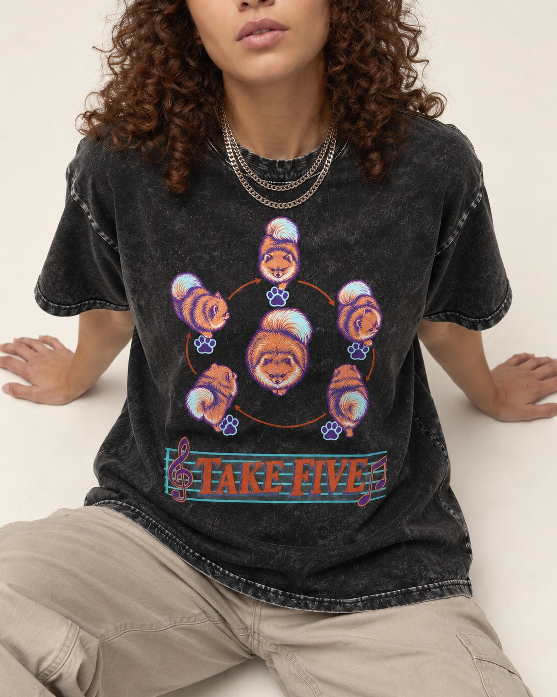 Pomeranian Take Five Choreography Cycle Graphic Washed Tee in Black, worn by a seated model