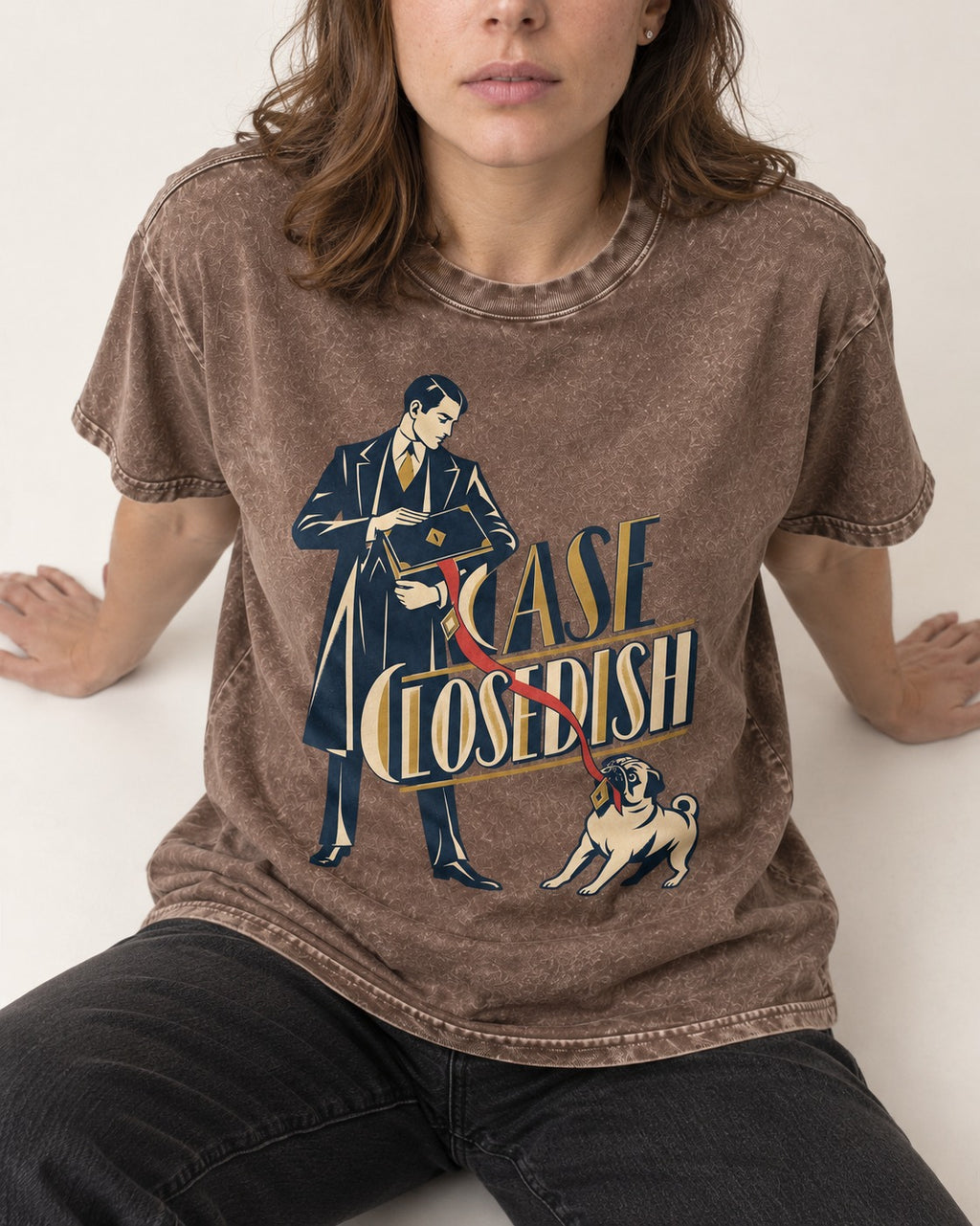 Case Closedish Pug Washed Tee in Coffee, worn by a seated model