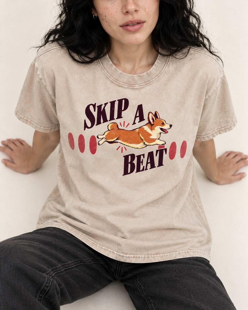 Skip a Beat Corgi Washed Tee in Apricot, worn by a seated model