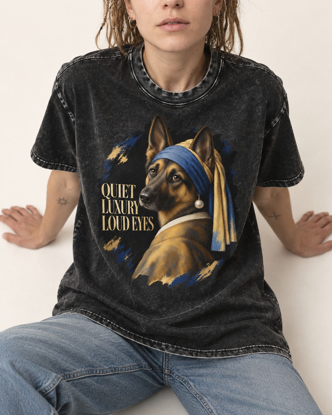 German Shepherd Dog Quiet Luxury Loud Eyes Pearl Portrait Washed Tee in Black, worn by a seated model